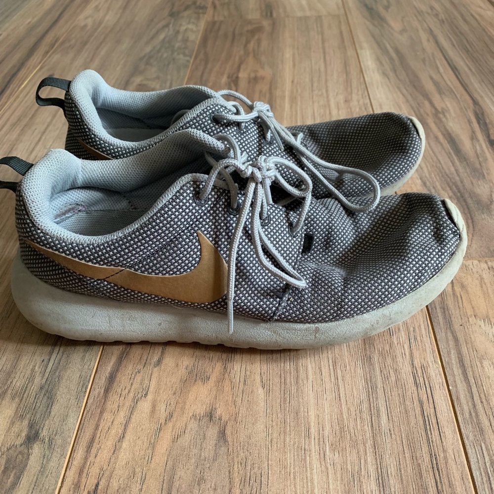 Silver and gold Nike roshe